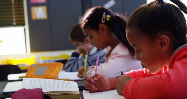 Diverse Children Studying in Classroom with Intense Focus - Download Free Stock Images Pikwizard.com