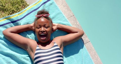 Joyful Relaxation by Poolside in Striped Swimsuit on Summer Day