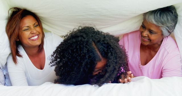 Three Generations of Women Laughing Under Blanket - Download Free Stock Images Pikwizard.com