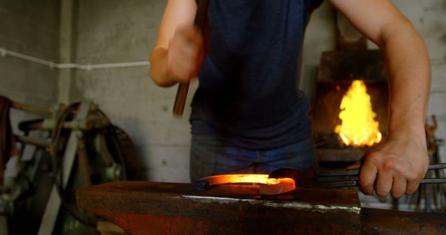 Blacksmith Forging Metal in Workshop with Fiery Furnace - Download Free Stock Images Pikwizard.com