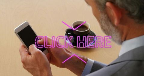 Executive tapping smartphone with neon click here overlay, coffee cup on desk, productivity