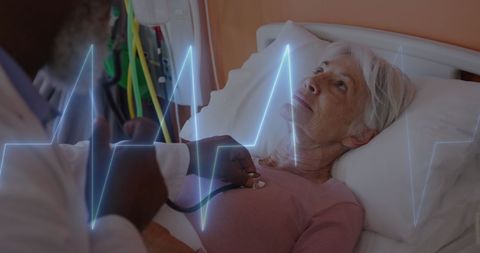 Doctor Checking Heart Beat of Senior Patient in Hospital