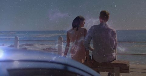 Romantic Couple on Bench Overlooking Ocean with Celestial Overlay