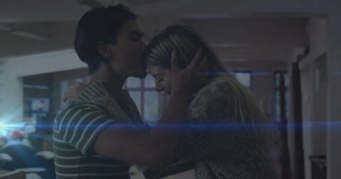 Romantic Couples Embracing in Cozy Home Setting