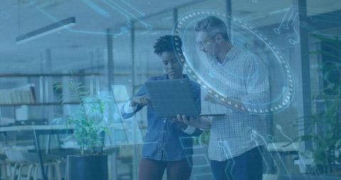 Colleagues Collaborating on Digital Innovation in Modern Office