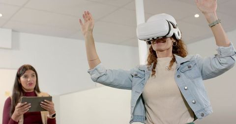 Colleagues Embracing VR Technology in Modern Office Environment