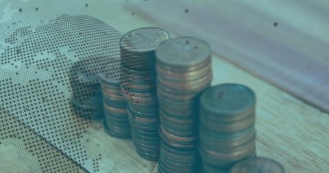 Rising Copper Coin Stacks with Dotted World Map Overlay