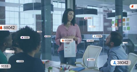 Businesswoman Leading Meeting with Digital Notifications