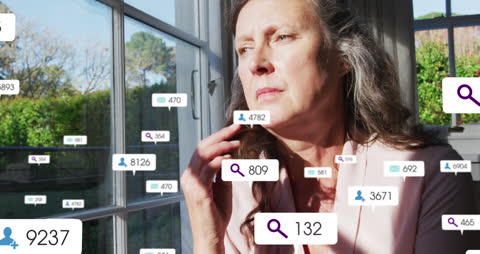 Woman Contemplating Social Media Engagement Near Window Light