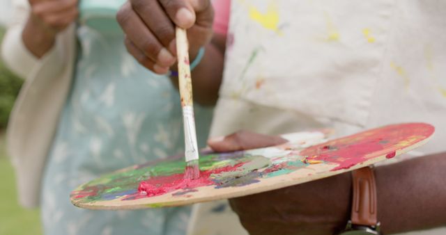 Close-up of Artist Mixing Bright Colors on Palette - Download Free Stock Images Pikwizard.com