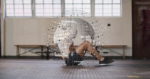 Athlete performing crunch with holographic globe overlay in futuristic gym training