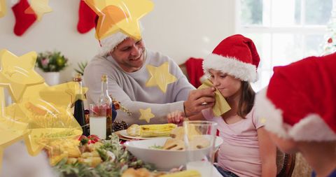 Father and Daughter Enjoying Christmas Dinner Together
