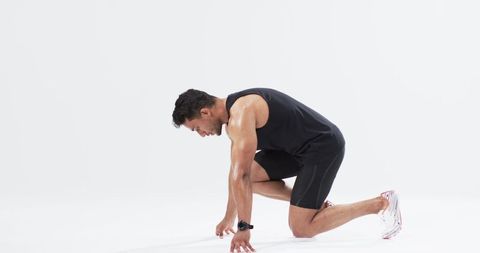 Athlete Preparing to Sprint on White Background - Download Free Stock Images Pikwizard.com