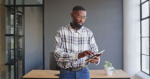 Business Professional Using Tablet in Contemporary Office Space