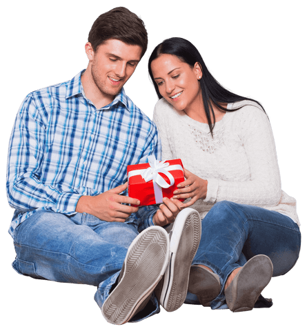 Happy couple holding christmas gift on transparent background