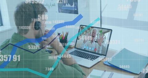Businessman Using Laptop for Video call with Virtual Financial Data Overlay