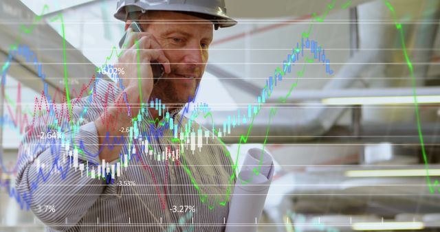 Engineer Analyzing Construction Blueprints While Discussing Stock Market Trends - Download Free Stock Images Pikwizard.com