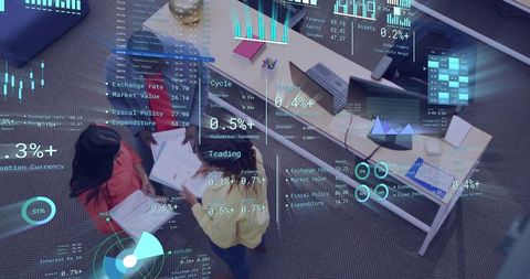 Team reviewing documents with augmented reality data overlay in modern office