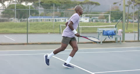 Focused Tennis Player Preparing to Return Ball on Court
