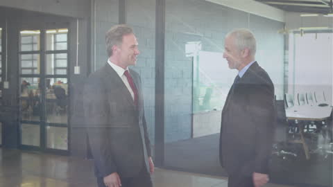 Businessmen Shaking Hands Overlaid with Cityscape Animation
