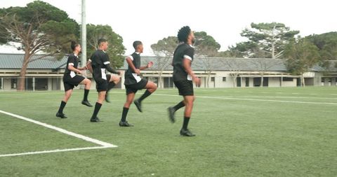 Teen Soccer Players Practicing Drills for Coordination and Teamwork