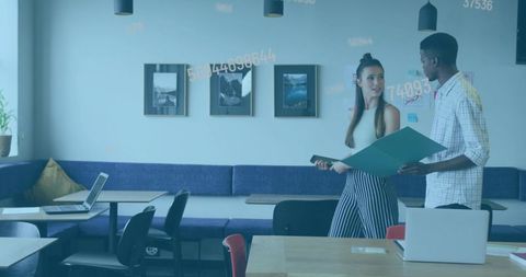 Discussing project in modern coworking lounge with tablet and teal folder, teamwork