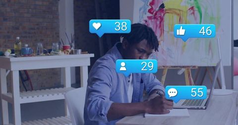 Creative Artist Engaged with Digital Presence in Art Studio