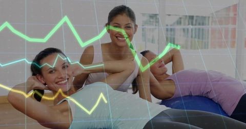 Women exercising with fitness graph overlay in gym studio