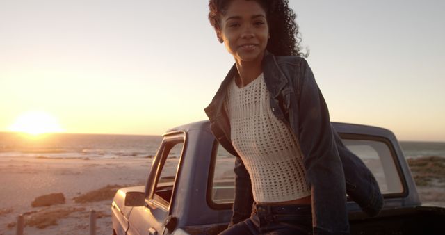 Young Woman Enjoying a Scenic Sunset by the Beach - Download Free Stock Images Pikwizard.com