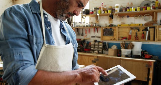 Carpenter Using Digital Tablet in Workshop for Design Plans - Download Free Stock Images Pikwizard.com