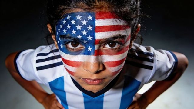 Young girl wearing american flag face paint looking up hands-on-hips dramatic portrait