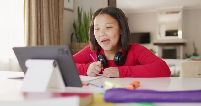 Image of happy asian girl having online lessons - Download Free Stock Photos Pikwizard.com