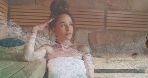 Woman in Sauna with Ocean Overlay Serenity and Relaxation Concept