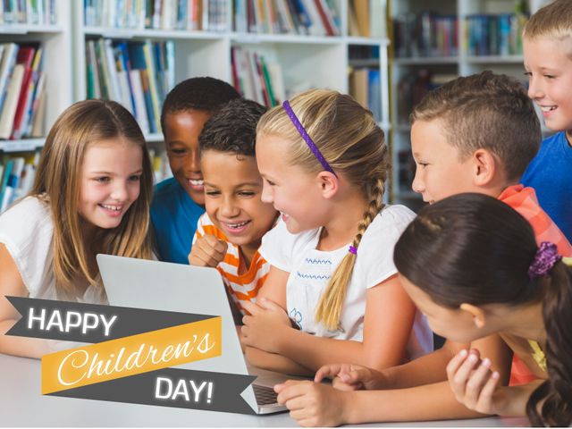 Composition of happy children's day text and diverse children using laptop in library. Children's day, childhood and happiness concept digitally generated image.