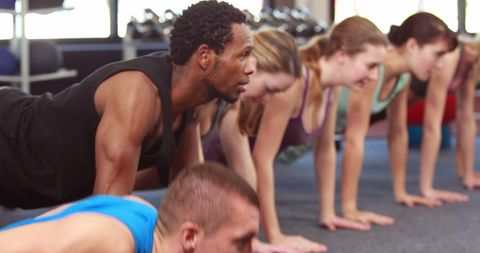 Diverse Group Exercising with Push-Ups in Fitness Class - Download Free Stock Images Pikwizard.com