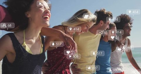 Friends enjoying beach walk with social media connections