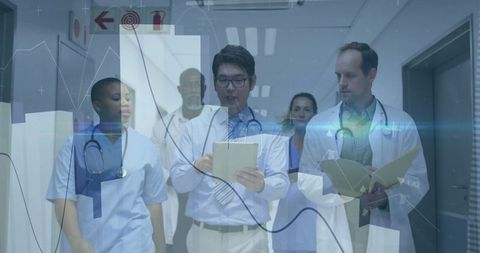 Healthcare Professionals Analyzing Data in Hospital Corridor