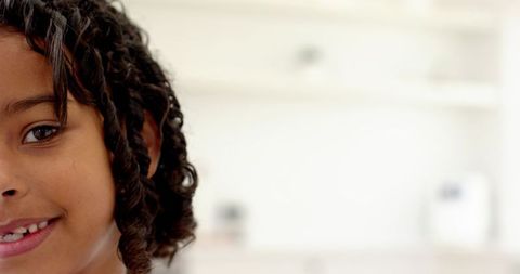 Smiling African American Child in Bright Home Interior