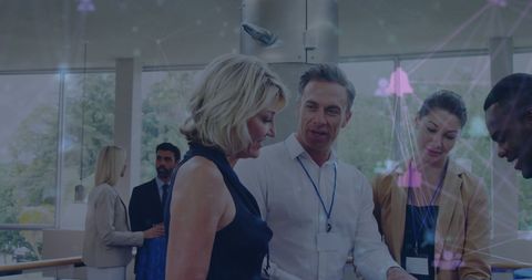 Diverse Business Team Engaging with Digital Technology at Office - Download Free Stock Images Pikwizard.com