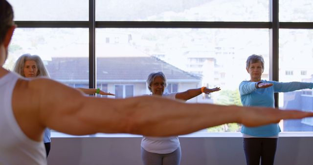 Senior women exemplify lifelong wellness through a focused yoga class. - Download Free Stock Photos Pikwizard.com