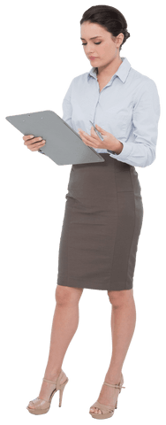 Transparent businesswoman reviewing clipboard information