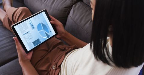 Woman Analyzing Data Charts on Tablet at Home - Download Free Stock Images Pikwizard.com