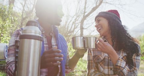Couple Enjoying Hot Drink During Countryside Hike