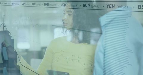 Business Professionals Discussing Exchange Rates in Modern Office