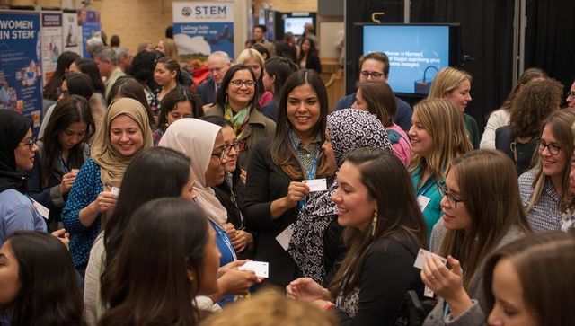 Diverse women networking at stem conference exchanging ideas