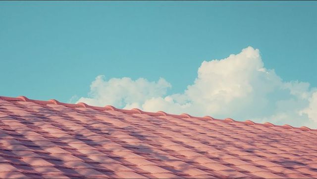 Terracotta Roof Tiles Against Clear Blue Sky Background