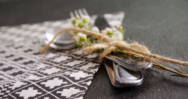 Elegant Table Setting with Wrapped Cutlery on Printed Napkin - Download Free Stock Images Pikwizard.com