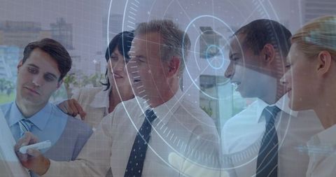Collaborating business team pointing at whiteboard with hud overlay for strategic planning