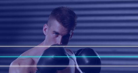 Caucasian Male Boxer Training in Neon Glow