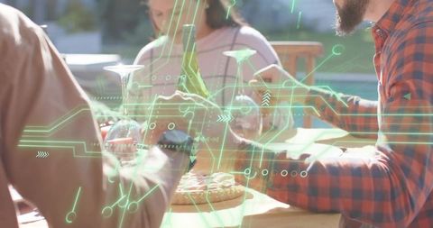 Friends enjoying backyard pizza and wine with augmented reality interface overlay